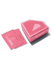 Two pink Timeless Skin Care serum sample packets next to a pink serum box on a clean white background.